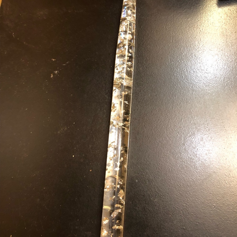 Heavy duty clear candle with silver flakes